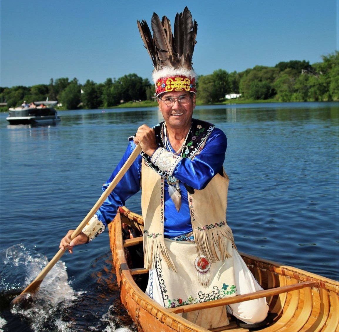 Reuben “Butch” Phillips Image of Reuben Phillips paddling a canoe