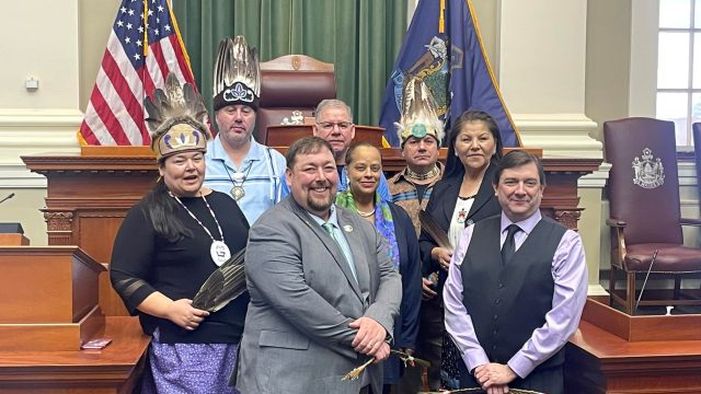 Front row (l-r): House Minority Leader Billy Bob Faulkingham and Senate President Troy Jackson; Second row (l-r): Chief Sabattis, House Speaker Rachel Talbot Ross, Chief Newell; Back row: Chief Francis, Chief Peter-Paul, Chief Nicholas.