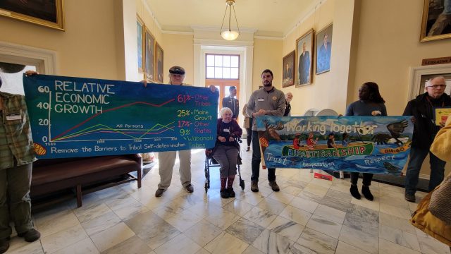 Allies at Lobby Day held banners created by the Artists Rapid Response Team (ARRT!).